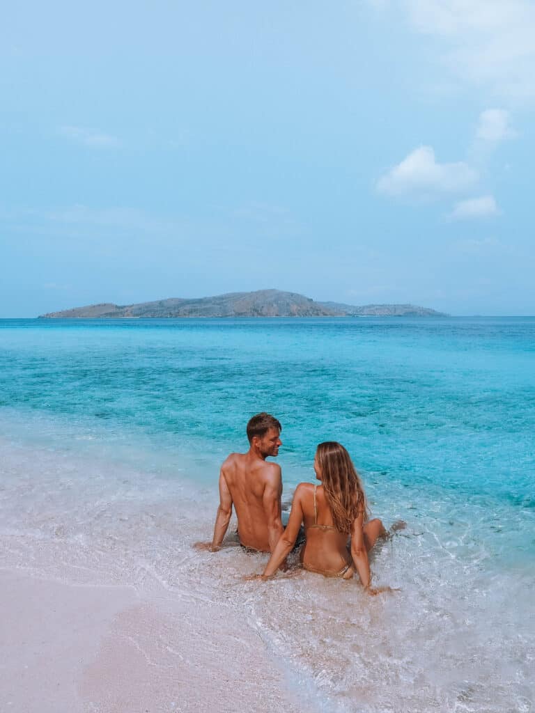 Komodo Le Pirate Island Beach Couple Sitting