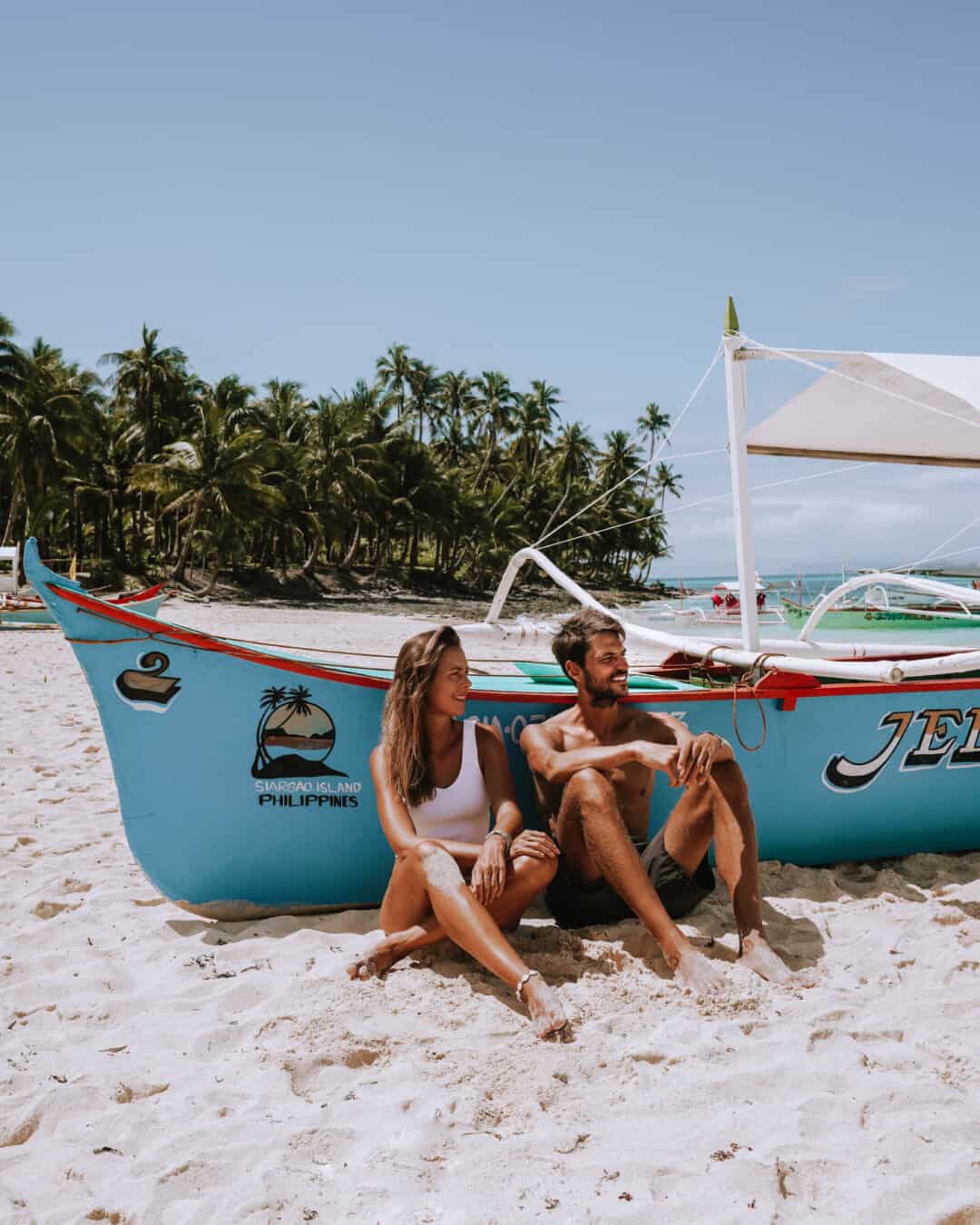 Siargao Daku Island Beach Boat Couple Sitting