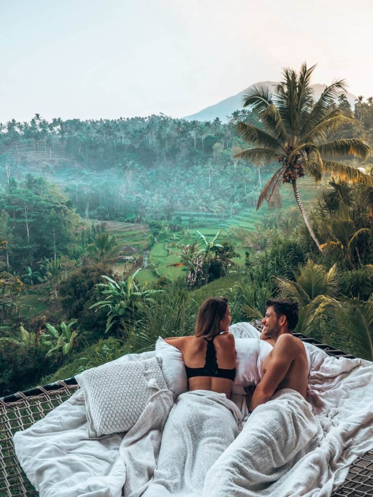 Couple chilling in net at Camaya Bali Bamboo House