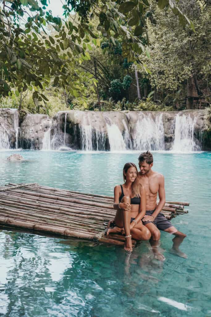 Couple on raft at Cambugahay Falls Siquijor Philippines