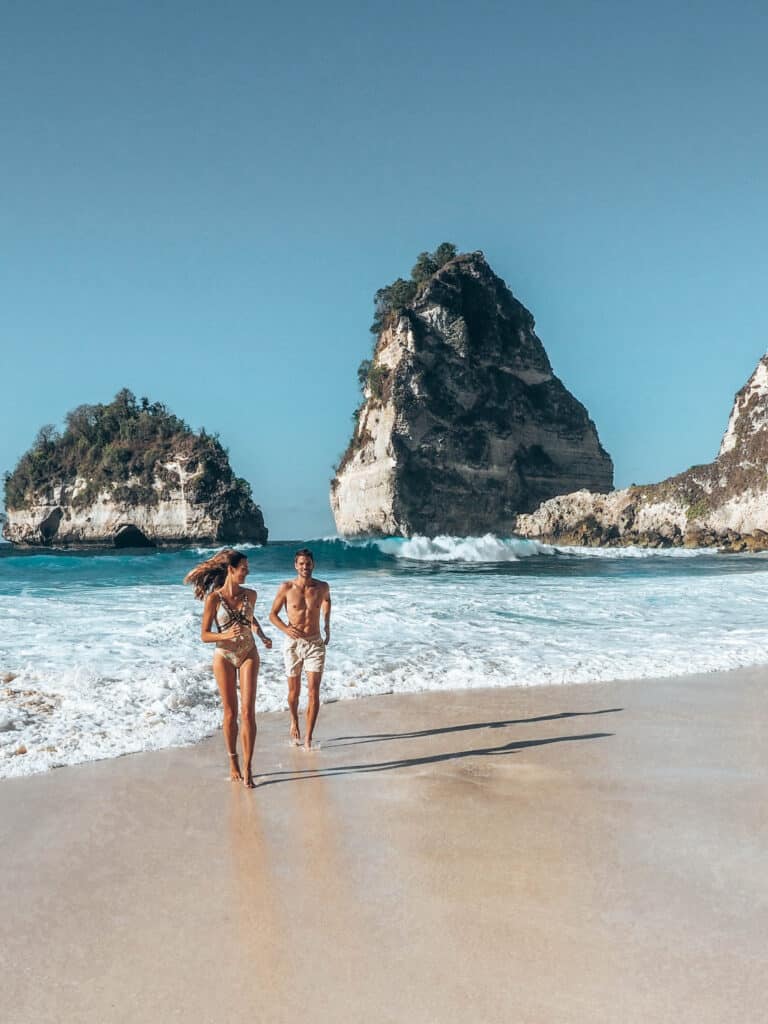 Couple running at Diamond Beach Nusa Penida