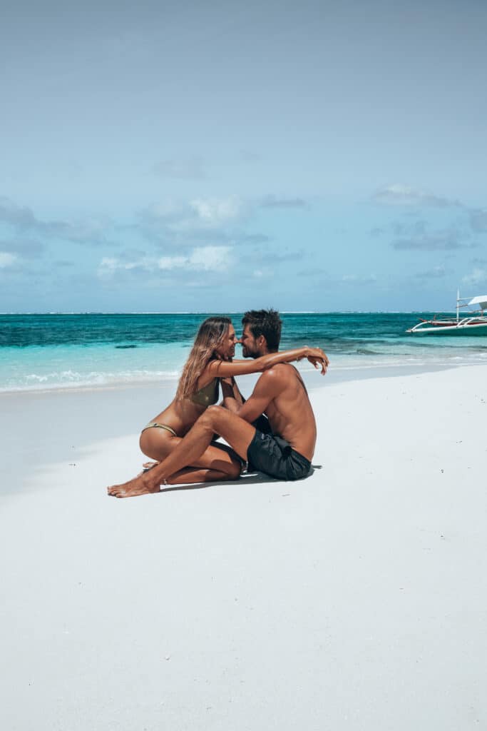 Couple on the beach of Guyam Island Siargao