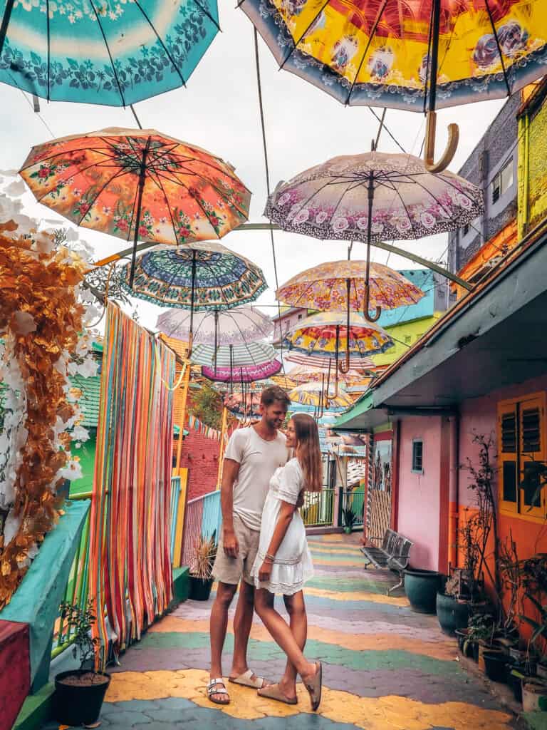 Couple under Umbrellas at Rainbow Village Malang