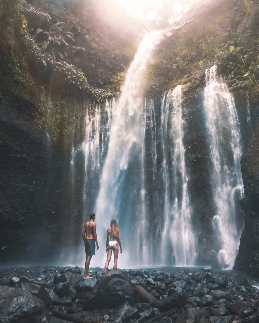 Couple in front of Tiu Kelep Waterfall Lombok