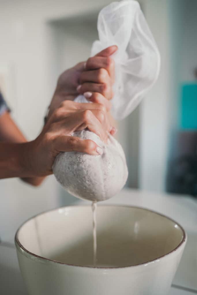 Pressing a nut milk bag