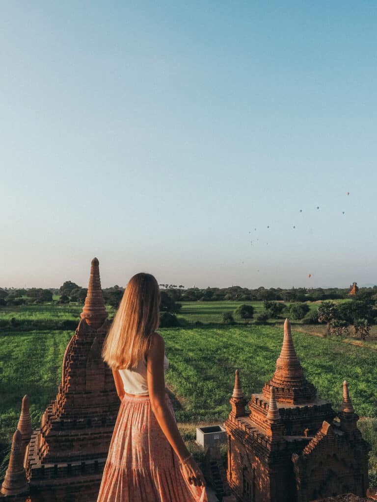 Women on rooftop of Pagoda in Bagan Myanmar