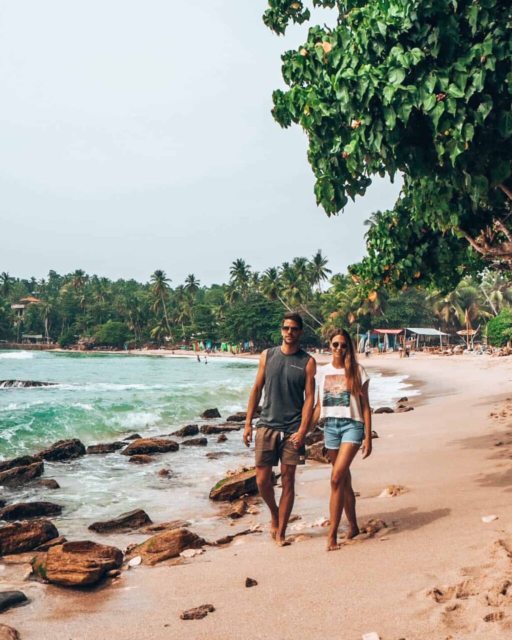 Hiriketiya Beach couple walking on beach