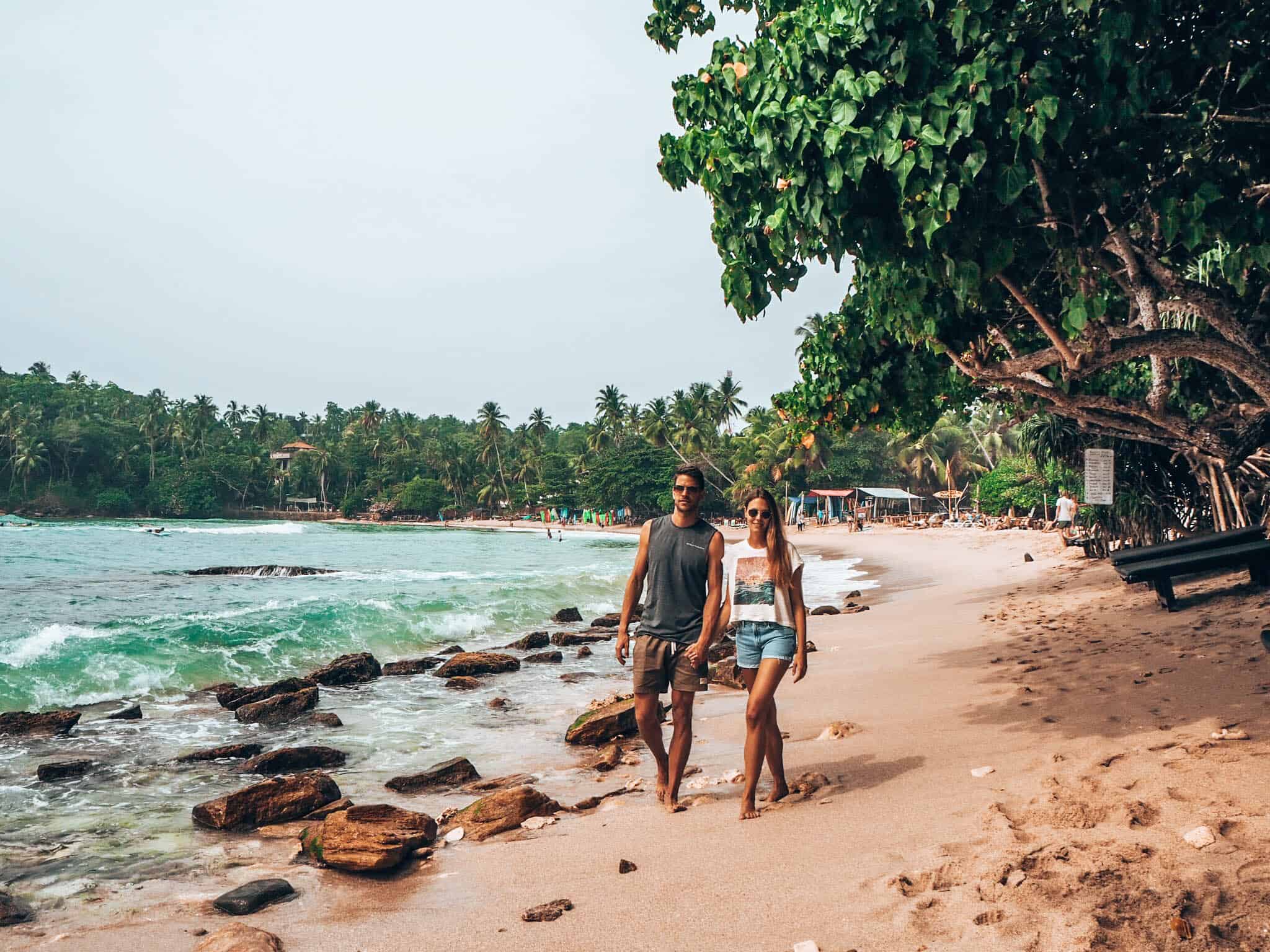 Hiriketiya Beach couple walking on beach