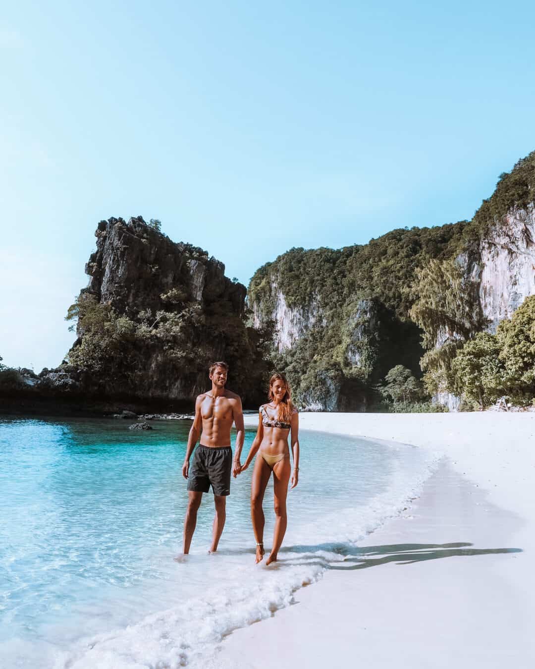 Couple walking on Koh Hong Island Beach Krabi