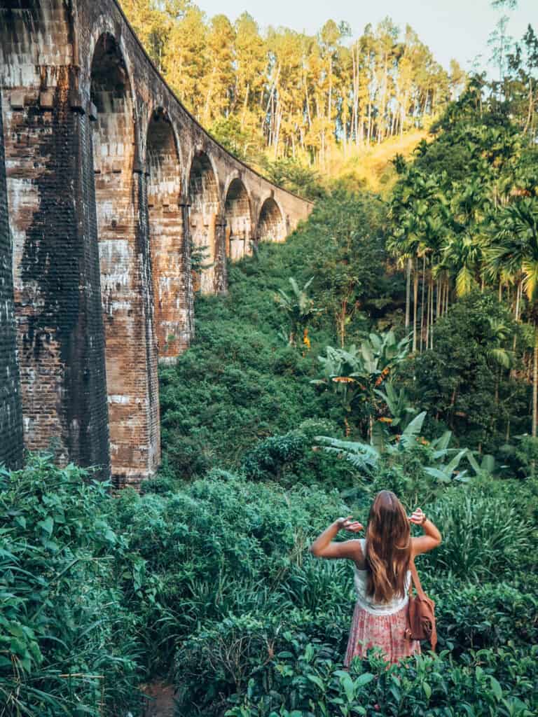 Women in tea field next to nine arches bridge ella