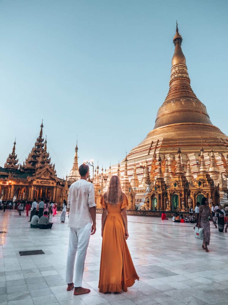 Couple looking at Shwedagon Pagoda Yangon