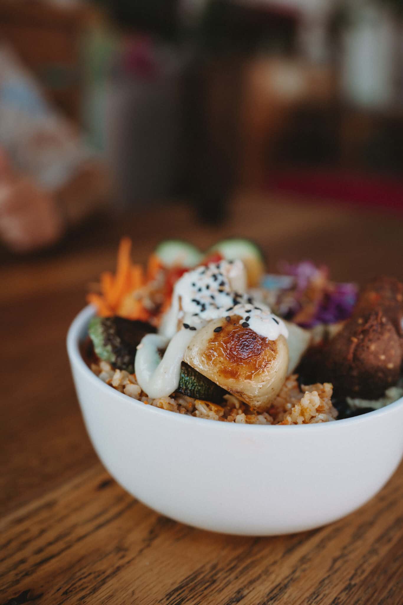 A bowl of food on a wooden table in Sayulita, Mexico.