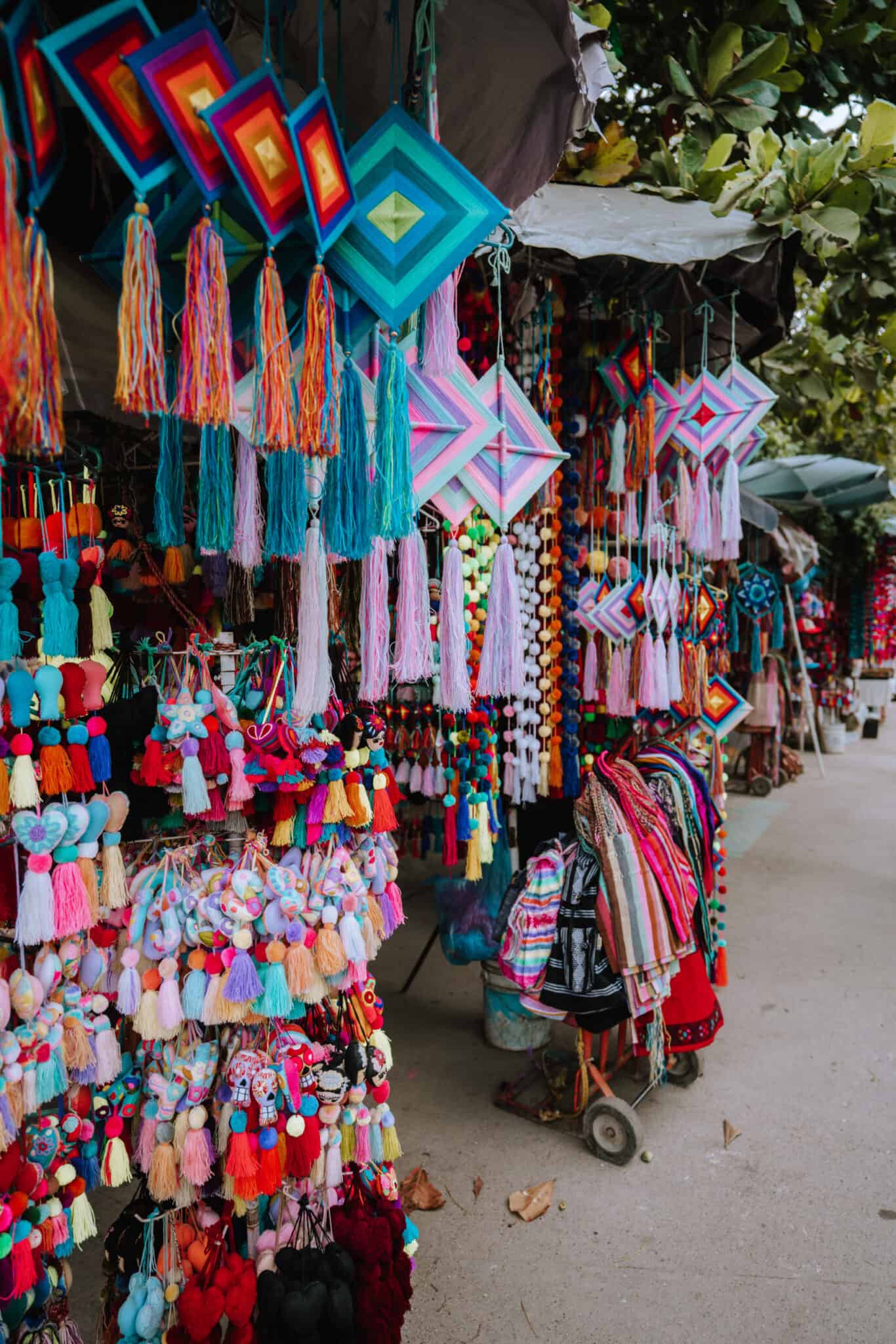 Colorful tassels hanging from a Sayulita market stall.