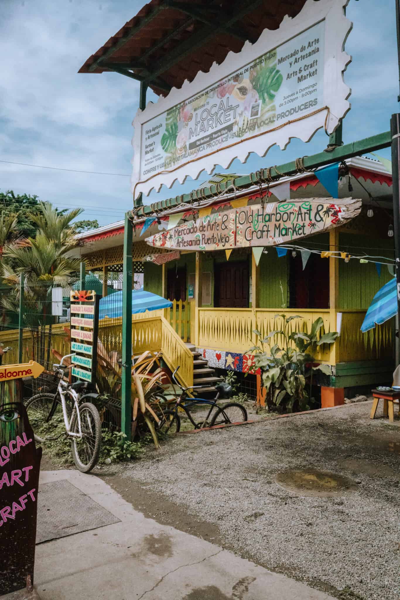 A colorful building in Puerto Viejo, Costa Rica, with a bicycle parked in front.