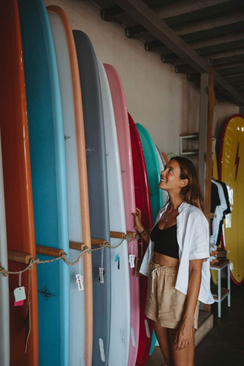 Looking at surfboards at cheboards store Tamarindo