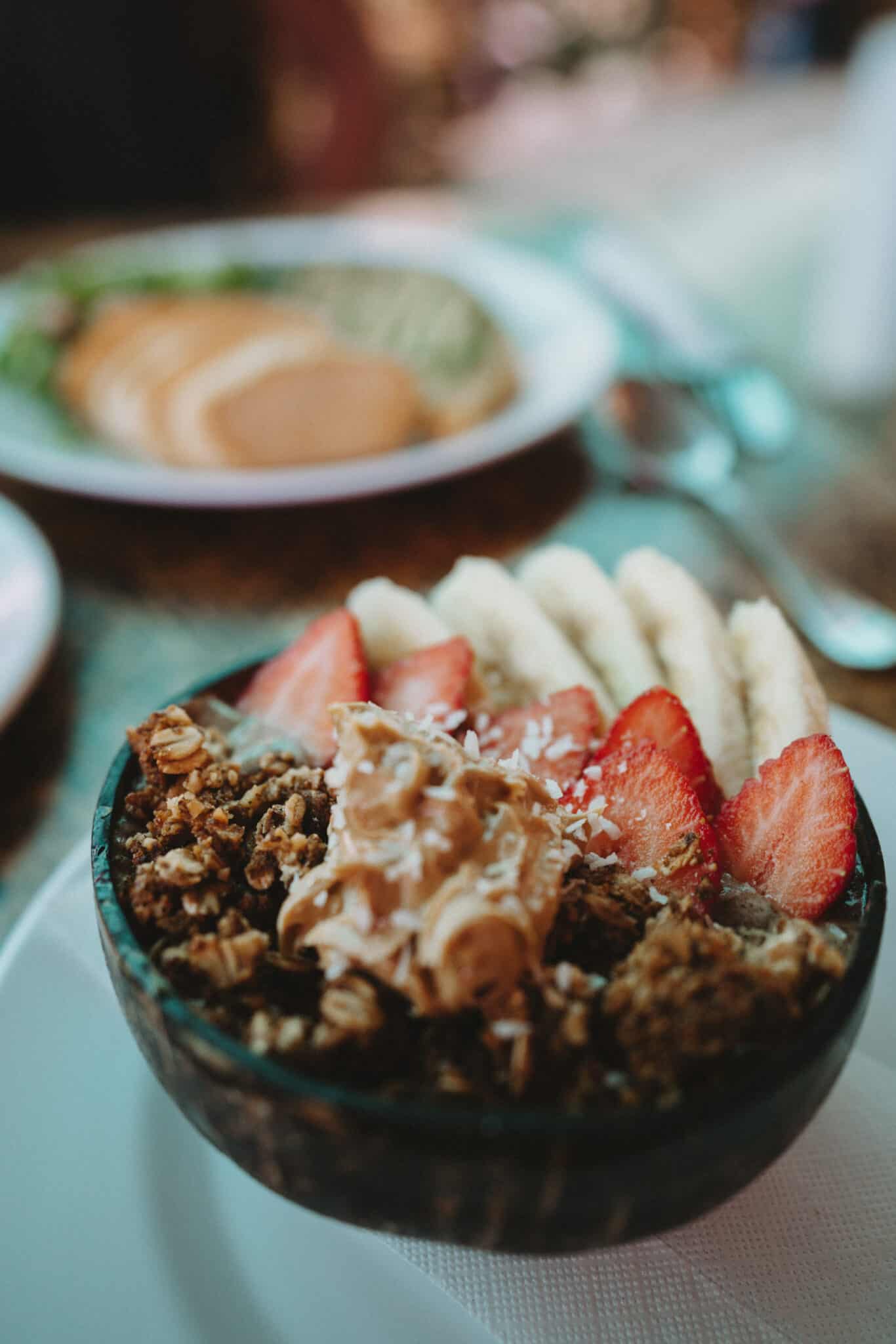 A bowl of granola with strawberries and bananas in Uvita Costa Rica.