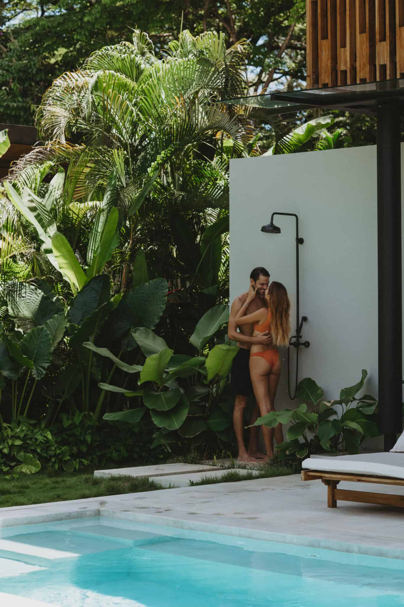 A man and woman at a pool working together.