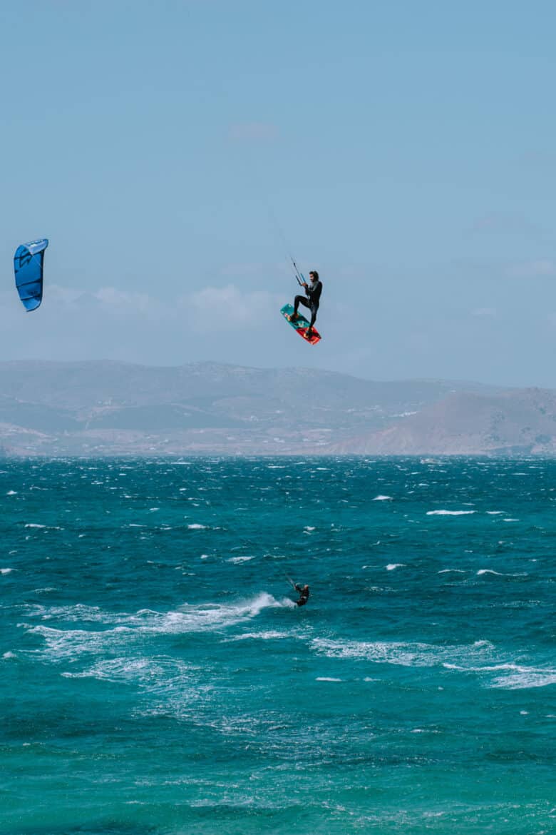 Two people kitesurfing off Naxos Island.