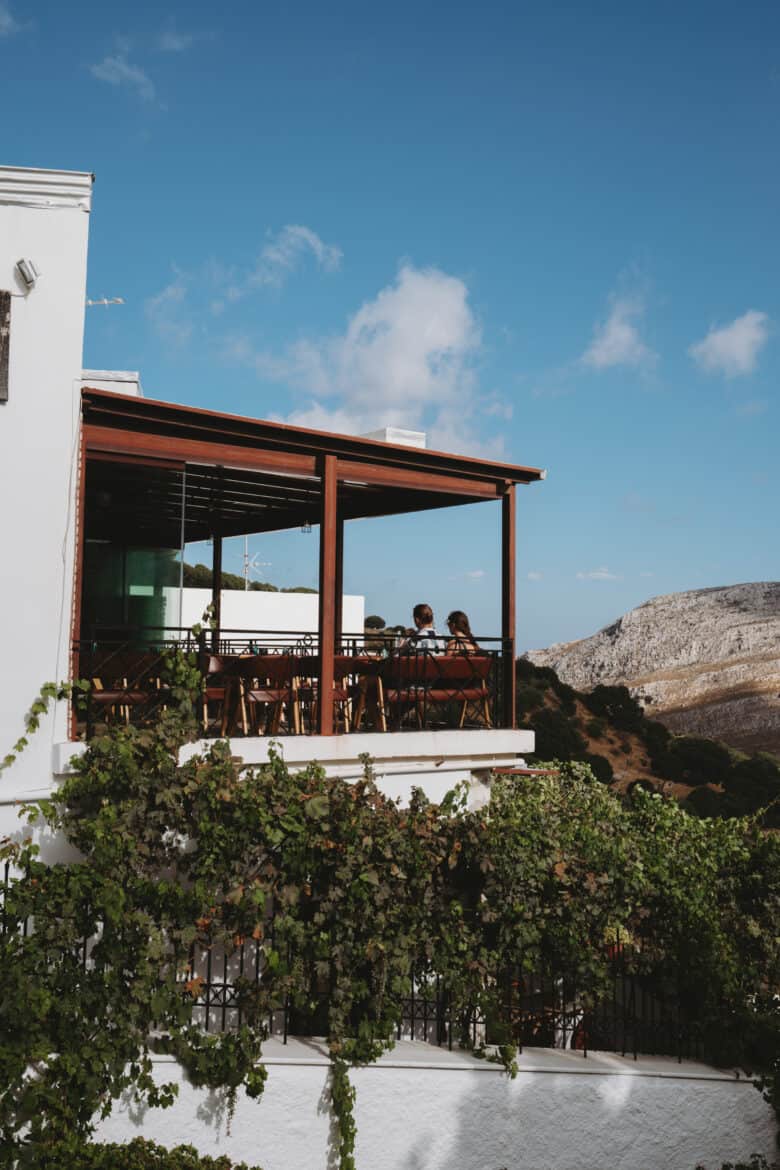 A white building with a balcony overlooking Naxos Island.