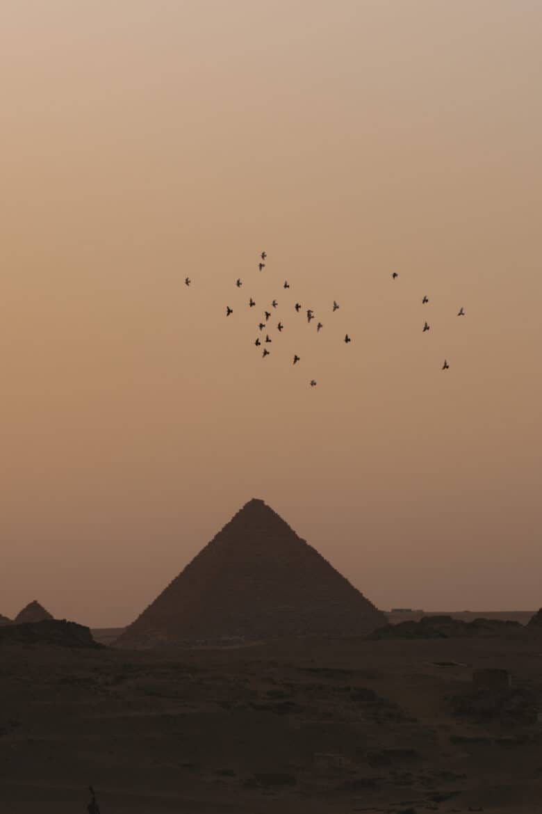 Egypt at dusk with pyramids of giza.