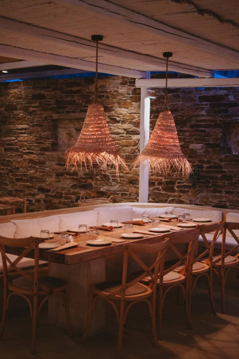 A wooden dining room table and chairs on ios island.