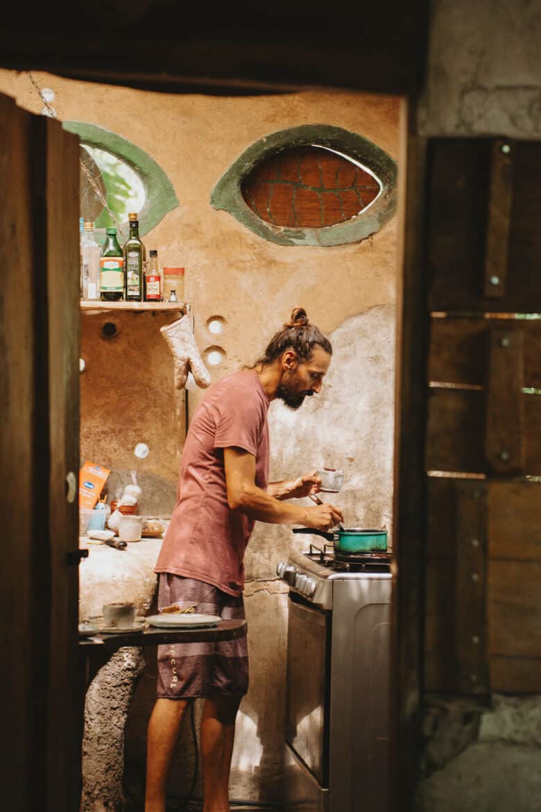 A man preparing food in a Montezuma kitchen.