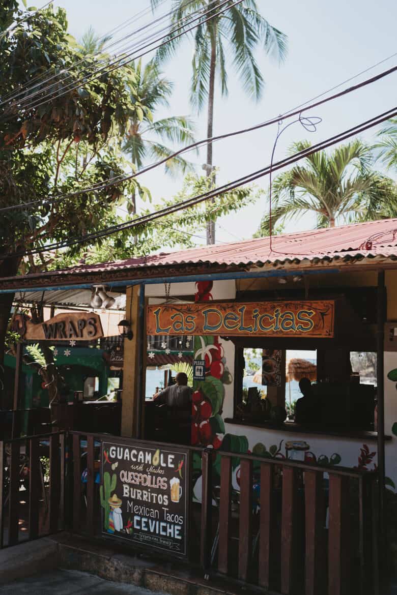 A Montezuma Costa Rica building with a sign on it.