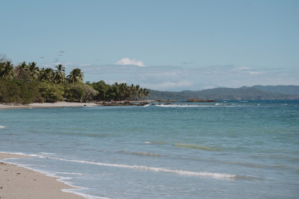 Montezuma beach in Costa Rica with white sand.